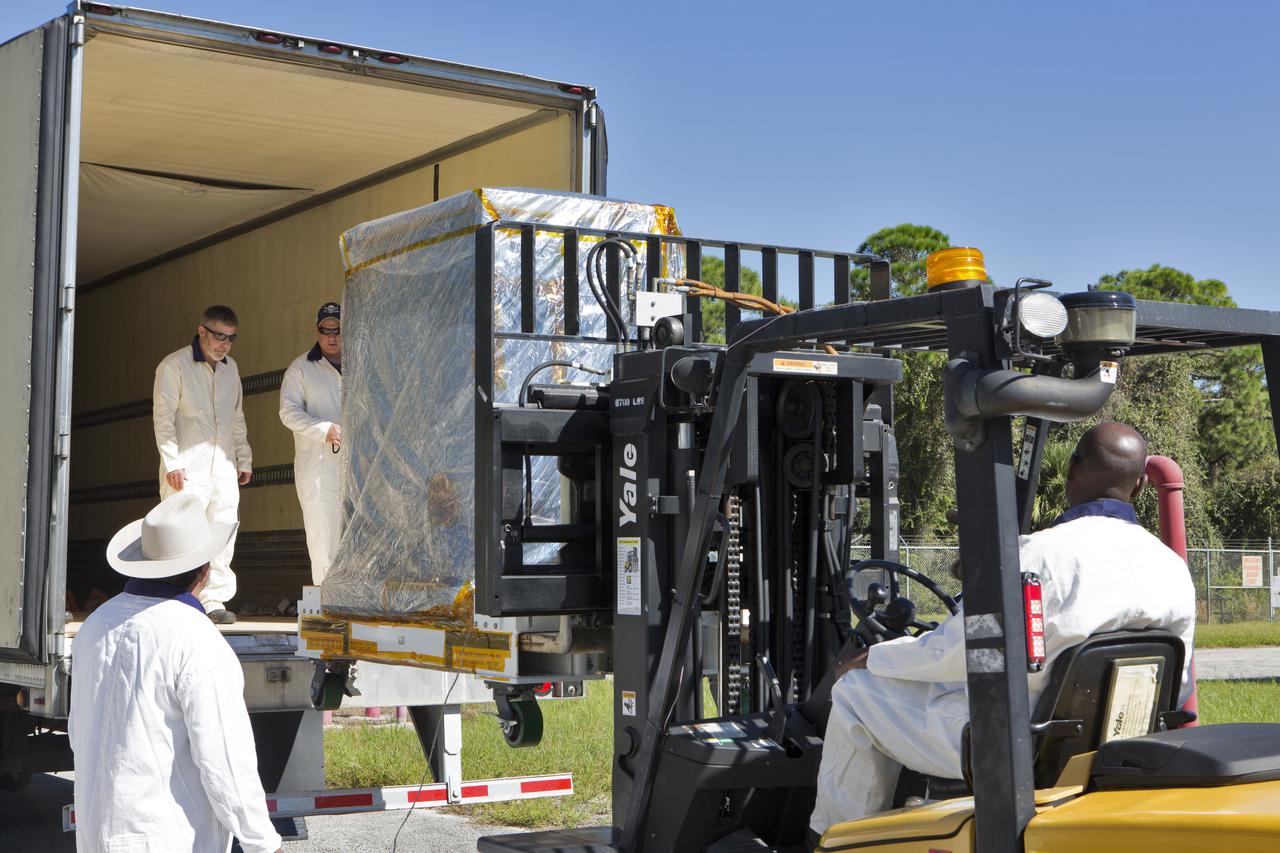 A forklift is used to load the Robotic Refueling Mission-3 (RRM3) payload onto a truck at the Fuel Transfer Building for transport to the SpaceX facility on Oct. 30, 2018, at NASA's Kennedy Space Center in Florida. The payload will be carried to the International Space Station on SpaceX's 16th Commercial Resupply Services mission. RRM3 demonstrates the transfer of xenon gas and liquid methane in microgravity, and advances technologies for storing and manipulating these cryogenic fuels robotically. RRM3 also supports development of technology for the Restore-L mission, a robotic spacecraft equipped to service satellites in-orbit.