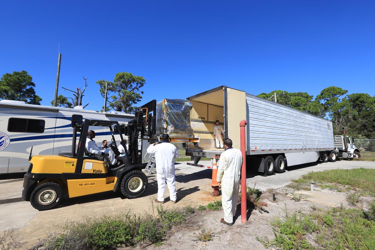 A forklift is used to load the Robotic Refueling Mission-3 (RRM3) payload onto a truck at the Fuel Transfer Building for transport to the SpaceX facility on Oct. 30, 2018, at NASA's Kennedy Space Center in Florida. The payload will be carried to the International Space Station on SpaceX's 16th Commercial Resupply Services mission. RRM3 demonstrates the transfer of xenon gas and liquid methane in microgravity, and advances technologies for storing and manipulating these cryogenic fuels robotically. RRM3 also supports development of technology for the Restore-L mission, a robotic spacecraft equipped to service satellites in-orbit.