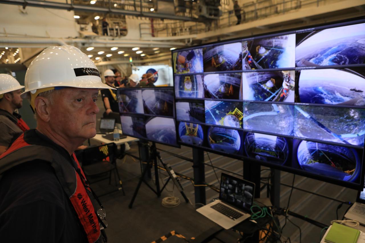 Apollo-era recovery engineer Milt Heflin observes the new ways in which the Orion crew capsule will be recovered after splashdown during Underway Recovery Test-7 on Oct. 30, 2018. The Exploration Ground Systems recovery team and the U.S. Navy will use a test version of the Orion crew module, several rigid hull inflatable boats and support equipment to verify and validate processes, procedures, hardware and personnel during recovery of Orion in open waters. The test is one in a series of tests to verify and validate procedures and hardware that will be used to recover the Orion spacecraft after it splashes down in the Pacific Ocean following deep space exploration missions. Orion will have emergency abort capability, sustain the crew during space travel and provide safe re-entry from deep space return velocities.