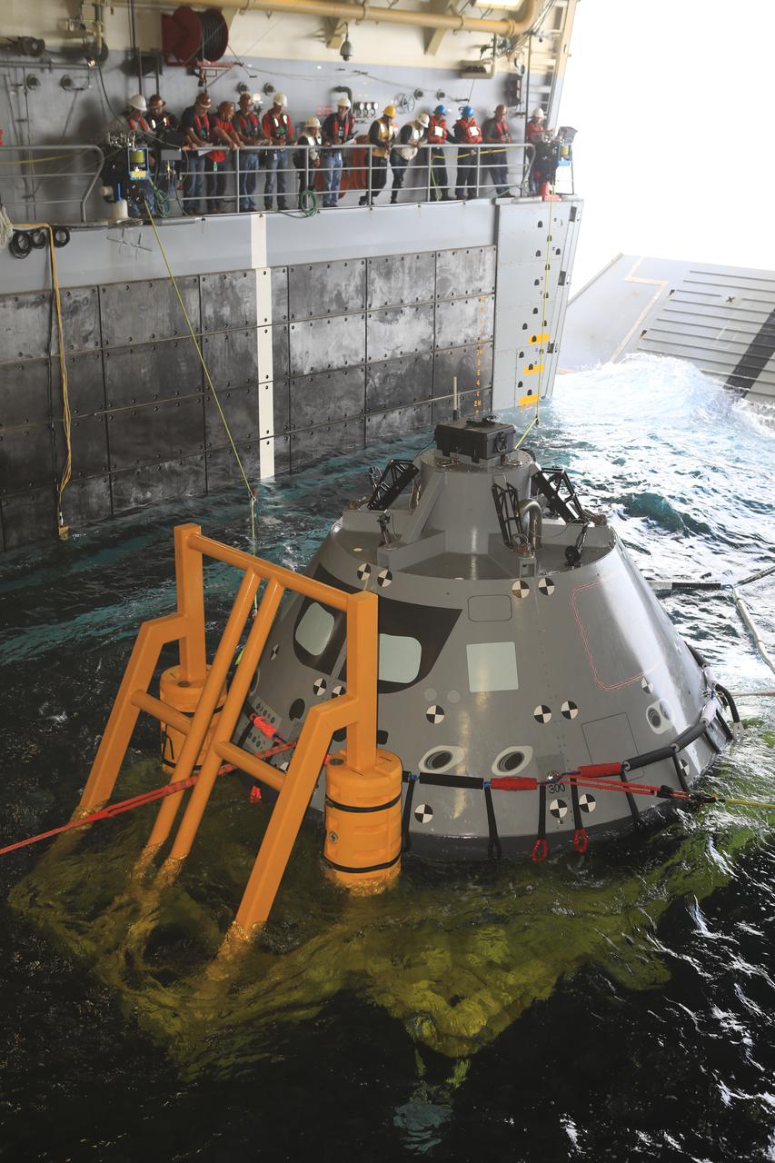 The Exploration Ground Systems (EGS) recovery team, along with the U.S. Navy, practice keeping an Orion test article under control in the well deck of a U.S. Navy ship as part of Underway Recovery Test-7 (URT-7) on Oct. 30, 2018, in the Pacific Ocean. EGS and the U.S. Navy will use a test version of the Orion crew module, several rigid hull inflatable boats and support equipment to verify and validate processes, procedures, hardware and personnel during recovery of Orion in open waters. The testing is one in a series of tests to verify and validate procedures and hardware that will be used to recover the Orion spacecraft after it splashes down in the Pacific Ocean following deep space exploration missions. Orion will have emergency abort capability, sustain the crew during space travel and provide safe re-entry from deep space return velocities.