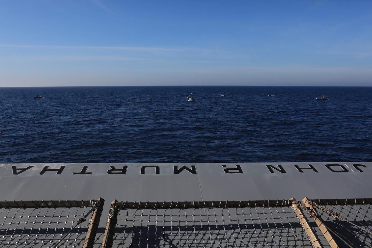 The Exploration Ground Systems Recovery Team, based out of Kennedy Space Center in Florida, is practicing recovering a test version of the Orion capsule during Underway Recovery Test-7 (URT-7), on Oct. 31, 2018, aboard the USS John P. Murtha, in the Pacific Ocean. URT-7 is one in a series of tests to verify and validate procedures and hardware that will be used to recover the Orion spacecraft after it splashes down in the Pacific Ocean following deep space exploration missions. Orion will have emergency abort capability, sustain the crew during space travel and provide safe re-entry from deep space return velocities.