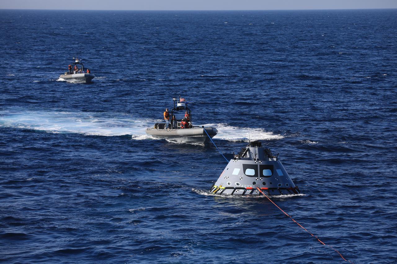The Exploration Ground Systems recovery team, along with the U.S. Navy, practice recovering a test version of the Orion capsule and bringing it inside the well deck of the USS John P. Murtha during Underway Recovery Test-7 (URT-7) on Oct. 31, 2018, in the Pacific Ocean. URT-7 is one in a series of tests to verify and validate procedures and hardware that will be used to recover the Orion spacecraft after it splashes down in the Pacific Ocean following deep space exploration missions. Orion will have emergency abort capability, sustain the crew during space travel and provide safe re-entry from deep space return velocities.