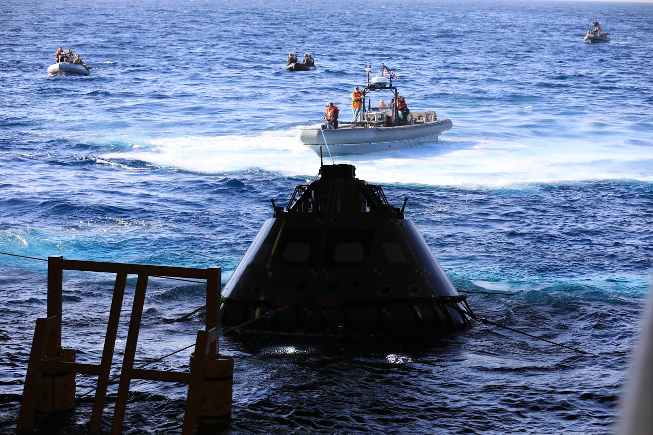 The Exploration Ground Systems Recovery Team, along with the U.S. Navy, practice recovering a test version of the Orion capsule and bringing it inside the well deck of the USS John P. Murtha during Underway Recovery Test-7 (URT-7) on Oct. 31, 2018, in the Pacific Ocean. URT-7 is one in a series of tests to verify and validate procedures and hardware that will be used to recover the Orion spacecraft after it splashes down in the Pacific Ocean following deep space exploration missions. Orion will have emergency abort capability, sustain the crew during space travel and provide safe re-entry from deep space return velocities.