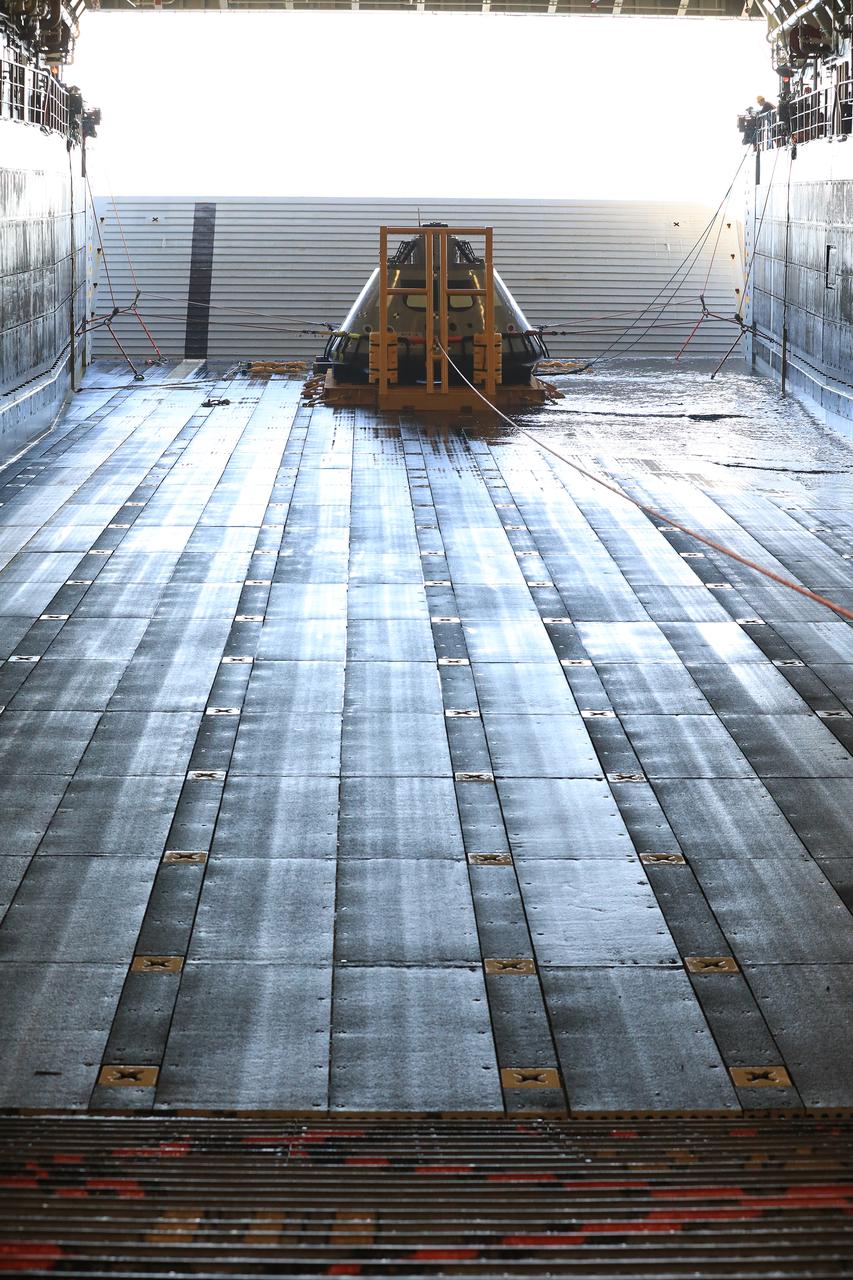 A test version of the Orion capsule sits in its cradle after being recovered from the Pacific Ocean during Underway Recovery Test-7 (URT) on Oct. 31, 2018, aboard the USS John P. Murtha. URT-7 is one in a series of tests to verify and validate procedures and hardware that will be used to recover the Orion spacecraft after it splashes down in the Pacific Ocean following deep space exploration missions. Orion will have emergency abort capability, sustain the crew during space travel and provide safe re-entry from deep space return velocities.