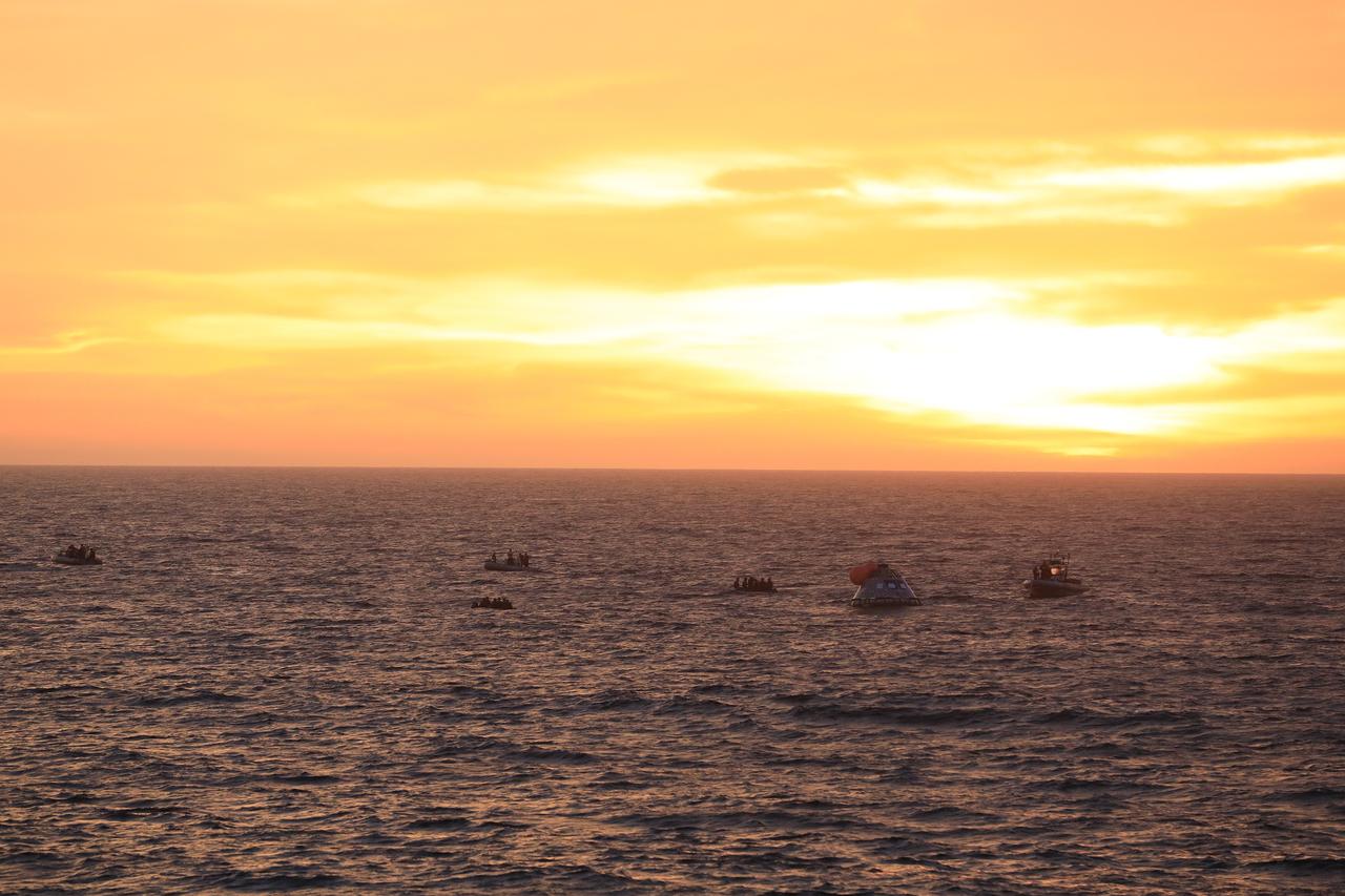 At sunset on Nov. 1, 2018, NASA's Recovery Team, along with the U.S. Navy, practice recovering a test version of the Orion capsule as part of Underway Recovery Test-7 (URT-7) in the Pacific Ocean. URT-7 is one in a series of tests to verify and validate procedures and hardware that will be used to recover the Orion spacecraft after it splashes down in the Pacific Ocean following deep space exploration missions. Orion will have emergency abort capability, sustain the crew during space travel and provide safe re-entry from deep space return velocities.