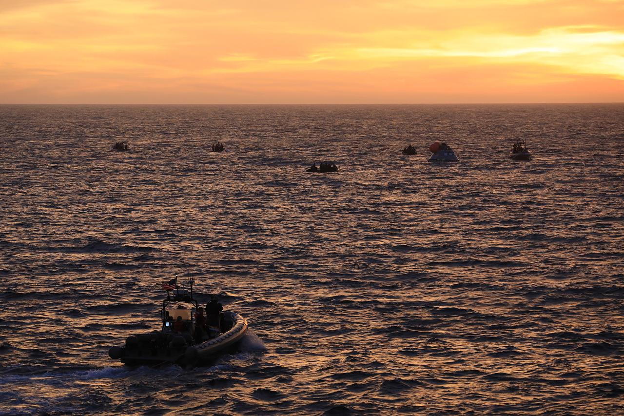 At sunset on Nov. 1, 2018, NASA's Recovery Team, along with the U.S. Navy, practice recovering a test version of the Orion capsule as part of Underway Recovery Test-7 (URT-7) in the Pacific Ocean. URT-7 is one in a series of tests to verify and validate procedures and hardware that will be used to recover the Orion spacecraft after it splashes down in the Pacific Ocean following deep space exploration missions. Orion will have emergency abort capability, sustain the crew during space travel and provide safe re-entry from deep space return velocities.