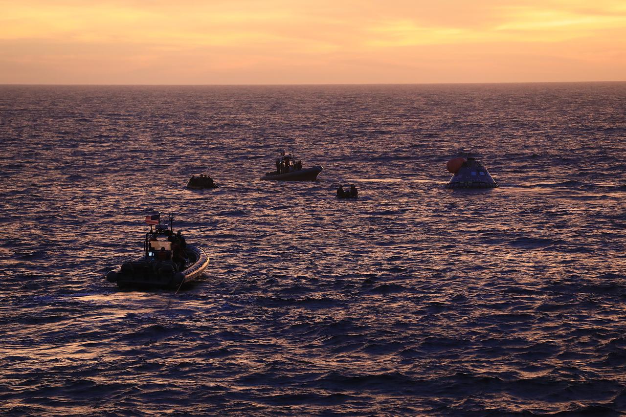 At sunset on Nov. 1, 2018, NASA's Recovery Team, along with the U.S. Navy, practice recovering a test version of the Orion capsule as part of Underway Recovery Test-7 (URT-7) in the Pacific Ocean. URT-7 is one in a series of tests to verify and validate procedures and hardware that will be used to recover the Orion spacecraft after it splashes down in the Pacific Ocean following deep space exploration missions. Orion will have emergency abort capability, sustain the crew during space travel and provide safe re-entry from deep space return velocities.