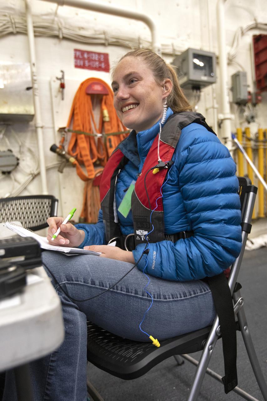Stacey Provin, operations project engineer with NASA, reviews procedures during Underway Recovery Test-7 (URT-7), aboard the USS John P. Murtha on Nov. 4, 2018. NASA's Recovery Team, along with the U.S. Navy, practice recovering a test version of the Orion capsule as part of URT-7 in the Pacific Ocean. URT-7 is one in a series of tests to verify and validate procedures and hardware that will be used to recover the Orion spacecraft after it splashes down in the Pacific Ocean following deep space exploration missions. Orion will have emergency abort capability, sustain the crew during space travel and provide safe re-entry from deep space return velocities.