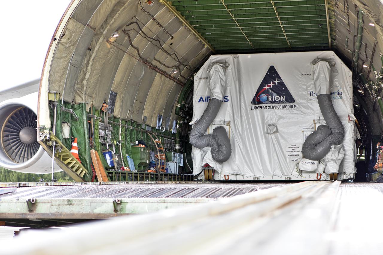 The shipping container holding the European Service Module (ESM) is in view inside the cargo hold of the Antonov cargo aircraft at the Shuttle Landing Facility at NASA's Kennedy Space Center in Florida on Nov. 6, 2018. The ESM for Exploration Mission-1 (EM-1) will be offloaded from the cargo hold. The ESM, built by the European Space Agency, will supply the main propulsion system and power to the Orion spacecraft for Exploration Mission-1 (EM-1), a mission to the Moon. The ESM also will house air and water for astronauts on future missions. EM-1 will be an uncrewed flight test that will provide a foundation for human deep space exploration to destinations beyond Earth orbit. EM-1 will be the first integrated test of NASA's Space Launch System, Orion and the ground systems at Kennedy.