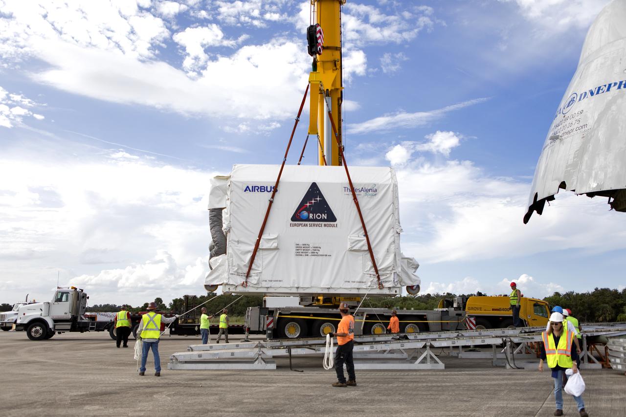 A crane lifts the shipping container holding the European Service Module (ESM) after it was moved out of the cargo hold of the Antonov cargo aircraft at the Shuttle Landing Facility at NASA's Kennedy Space Center in Florida on Nov. 6, 2018. The ESM, built by the European Space Agency, will supply the main propulsion system and power to the Orion spacecraft for Exploration Mission-1 (EM-1), a mission to the Moon. The ESM also will house air and water for astronauts on future missions. EM-1 will be an uncrewed flight test that will provide a foundation for human deep space exploration to destinations beyond Earth orbit. EM-1 will be the first integrated test of NASA's Space Launch System, Orion and the ground systems at Kennedy.