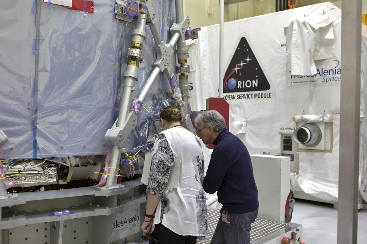 Inside the airlock in the Neil Armstrong Operations and Checkout Building high bay on Nov. 6, 2018, European Space Agency (ESA) and Airbus engineers check the ESA European Service Module (ESM) after it is uncrated at NASA's Kennedy Space Center in Florida. The ESM will supply the main propulsion system and power to the Orion spacecraft for Exploration Mission-1 (EM-1), a mission to the Moon. The ESM also will house air and water for astronauts on future missions. EM-1 will be an uncrewed flight test that will provide a foundation for human deep space exploration to destinations beyond Earth orbit. EM-1 will be the first integrated test of NASA's Space Launch System, Orion and the ground systems at Kennedy.