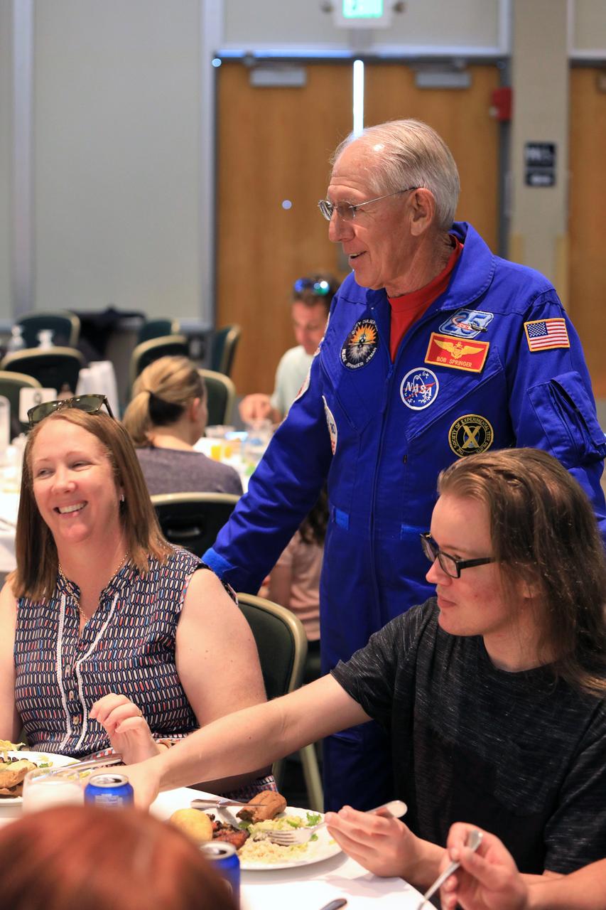 Retired NASA astronaut Bob Springer talks with students from Brevard County high schools during "Lunch with an Astronaut" at the NASA Kennedy Space Center Visitor Complex in Florida, on Nov. 7, 2018. The high school seniors were invited to Kennedy Space Center for a tour of facilities, lunch and a roundtable discussion with engineers, scientists and business experts at the center. The 2018 Brevard Top Scholars event was hosted by the center's Academic Engagement Office to honor the top three scholars of the 2018-2019 graduating student class from each of Brevard County’s public high schools. The students received a personalized certificate of recognition at the end of the day.