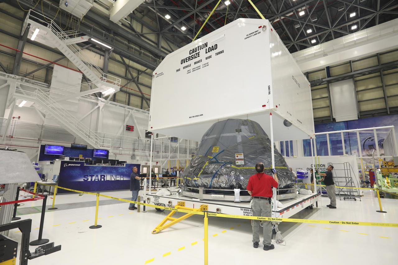 Inside the Commercial Crew and Cargo Processing Facility (C3PF) at NASA's Kennedy Space Center in Florida on Nov. 11, 2018, the spacecraft destined to fly astronauts to the International Space Station in Boeing's Crew Flight Test (CFT) is crated in preparation for transport to the company's testing facilities in El Segundo, California. The company's CST-100 Starliner will be undergoing a series of environmental tests designed to simulate what the spacecraft will experience during different stages of flight as part of NASA's Commercial Crew Program (CCP). The agency's CCP will return human spaceflight launches to U.S. soil, providing safe, reliable and cost-effective access to low-Earth orbit on systems that meet our safety and mission requirements.