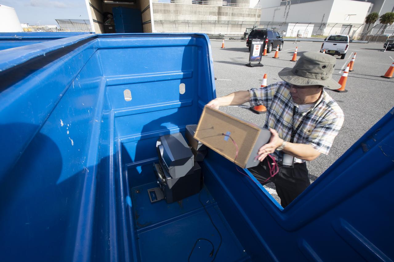In the parking lot of the Vehicle Assembly Building at NASA's Kennedy Space Center in Florida, employees turn in used household material for recycling as part of America Recycles Day (ARD). The annual event is a nationally recognized initiative dedicated to promoting recycling in the United States. This year, KSC is partnered with Goodwill Industries and several other local organizations to receive donation material from employees such as gently used household items, personal electronic waste, greeting cards and serviceable eyeglasses.