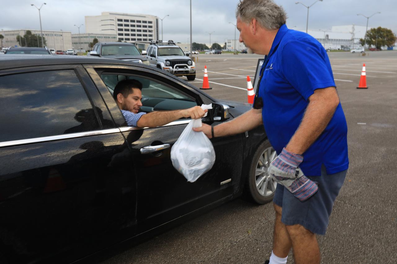 In the parking lot of the Vehicle Assembly Building at NASA's Kennedy Space Center in Florida, employees turn in used household material for recycling as part of America Recycles Day (ARD). The annual event is a nationally recognized initiative dedicated to promoting recycling in the United States. This year, KSC is partnered with Goodwill Industries and several other local organizations to receive donation material from employees such as gently used household items, personal electronic waste, greeting cards and serviceable eyeglasses.