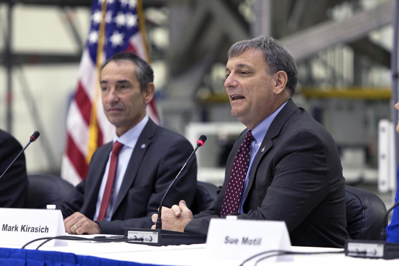 During a "Powering Exploration Mission-1" ceremony in the Neil Armstrong Operations and Checkout Building high bay at NASA's Kennedy Space Center on Nov. 16, 2018, Phillippe Deloo, left, European Service Module program manager at the European Space Agency (ESA); and Mark Kirasich, Orion Program manager at the agency's Johnson Space Center in Houston, answer questions. The event was held to mark a major milestone, the arrival of the European Service Module (ESM) for Orion's Exploration Mission-1. The service module, built by the European Space Agency, will supply the main propulsion system and power to the Orion spacecraft during EM-1, a mission to the Moon. The ESM also will house air and water for astronauts on future missions. EM-1 will be an uncrewed flight test that will provide a foundation for human deep space exploration to destinations beyond Earth orbit. EM-1 will be the first integrated test of NASA's Space Launch System, Orion and the ground systems at Kennedy.