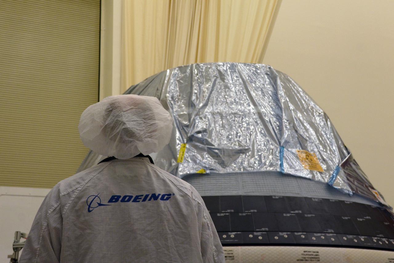 The spacecraft destined to fly astronauts to the International Space Station in Boeing's Crew Flight Test (CFT) is inspected following removal from its shipping container inside the company's testing facilities in El Segundo, California, on Nov. 21, 2018. The company's CST-100 Starliner will be undergoing a series of environmental tests designed to simulate what it will experience during different stages of flight as part of NASA's Commercial Crew Program (CCP). The agency's CCP will return human spaceflight launches to U.S. soil, providing safe, reliable and cost-effective access to low-Earth orbit on systems that meet our safety and mission requirements.