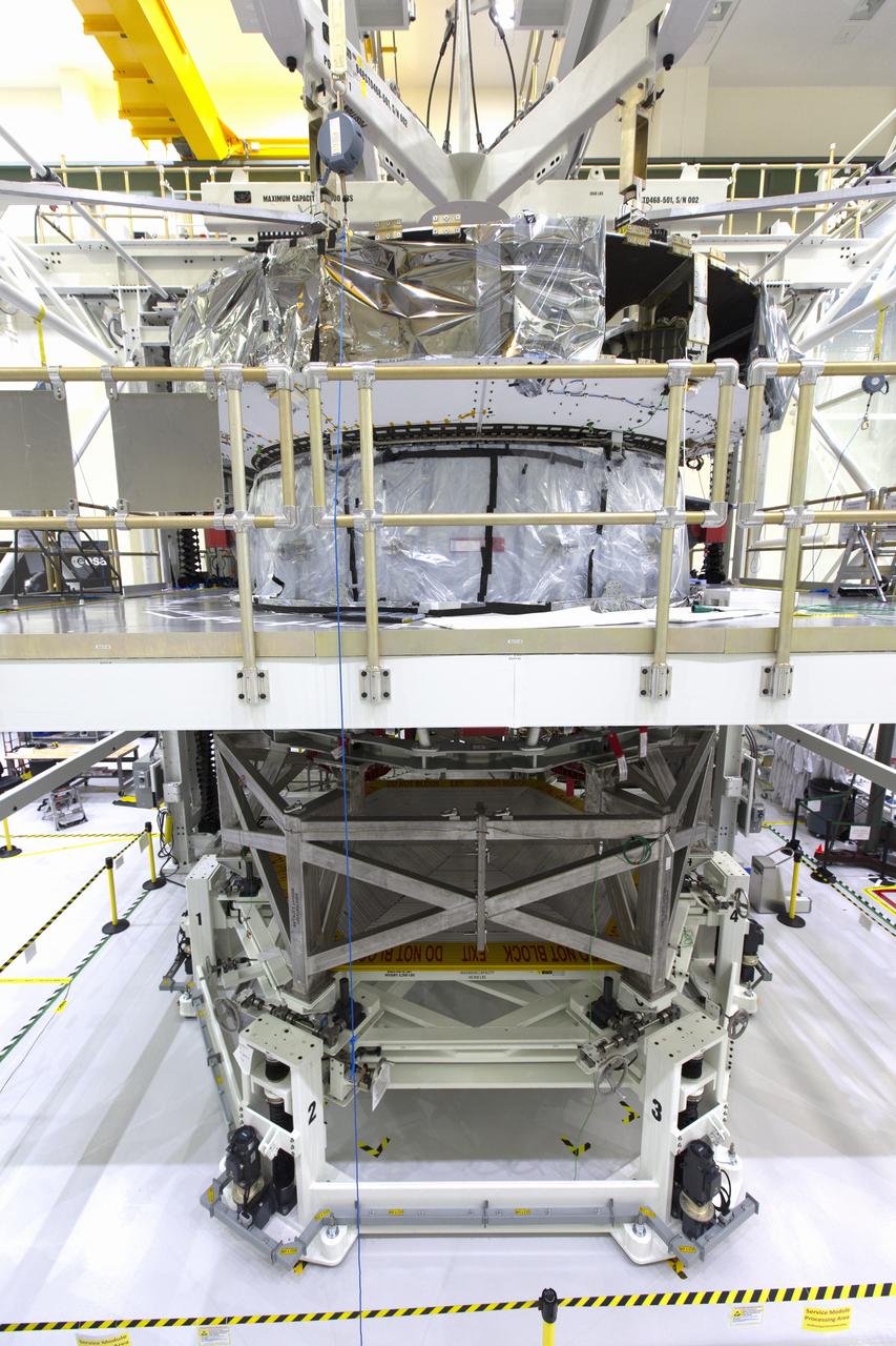 Inside the high bay of the Neil Armstrong Operations and Checkout Building at NASA's Kennedy Space Center in Florida, Orion's crew module adapter is mated to the European Service Module on Nov. 26, 2018. For the first time, NASA will use a European-built system as a critical element to power an American spacecraft, extending the international cooperation of the International Space Station into deep space. The European Service Module is a unique collaboration across space agencies and industry, including the European Space Agency's prime contractor, Airbus, and 10 European countries. The completion of service module work in Europe and shipment to Kennedy signifies a major milestone toward NASA's human deep space exploration missions to the Moon and beyond.