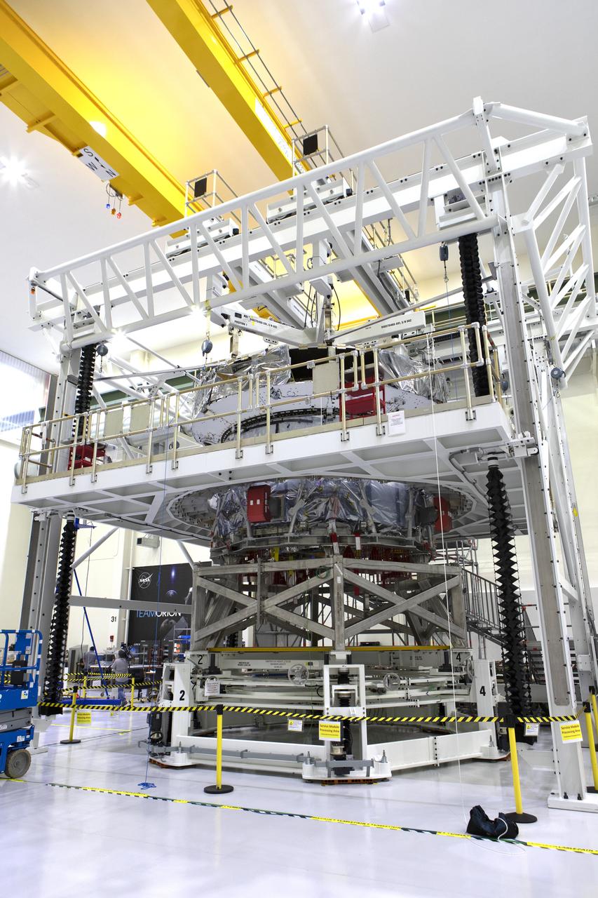 Inside the high bay of the Neil Armstrong Operations and Checkout Building at NASA's Kennedy Space Center in Florida, the European Service Module, below, is being mated to Orion's crew module adapter on Nov. 26, 2018. For the first time, NASA will use a European-built system as a critical element to power an American spacecraft, extending the international cooperation of the International Space Station into deep space. The European Service Module is a unique collaboration across space agencies and industry, including the European Space Agency's prime contractor, Airbus, and 10 European countries. The completion of service module work in Europe and shipment to Kennedy signifies a major milestone toward NASA's human deep space exploration missions to the Moon and beyond.