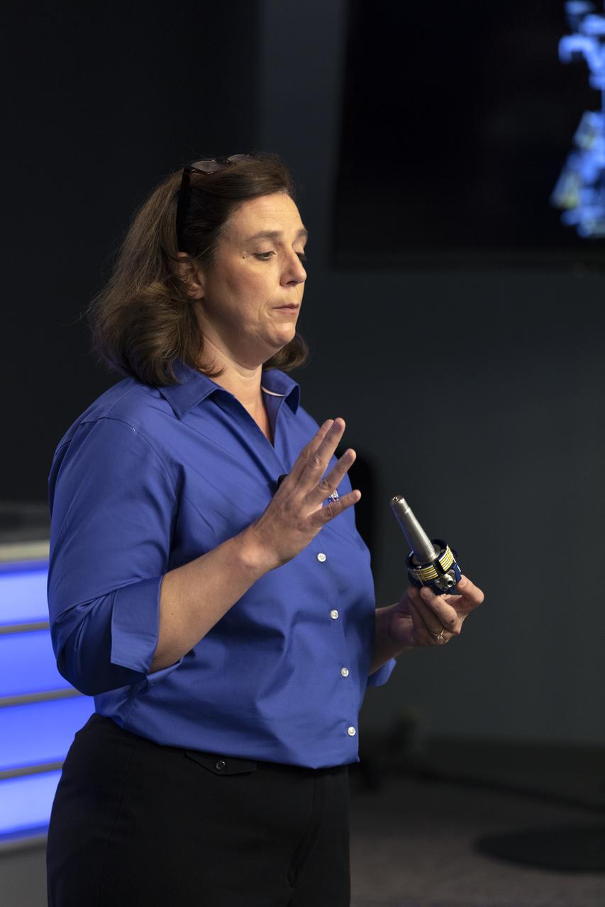 Jill McGuire, project manager for the Robotic Refueling Mission 3, or RRM3, experiment, describes RRM3 hardware for members of the media in the Kennedy Space Center’s Press Site auditorium. The briefing focused on research planned for launch to the International Space Station. The scientific materials and supplies will be aboard a Dragon spacecraft scheduled for liftoff from Cape Canaveral Air Force Station's Space Launch Complex 40. The SpaceX Falcon 9 rocket will launch the company's 16th Commercial Resupply Services mission to the space station.