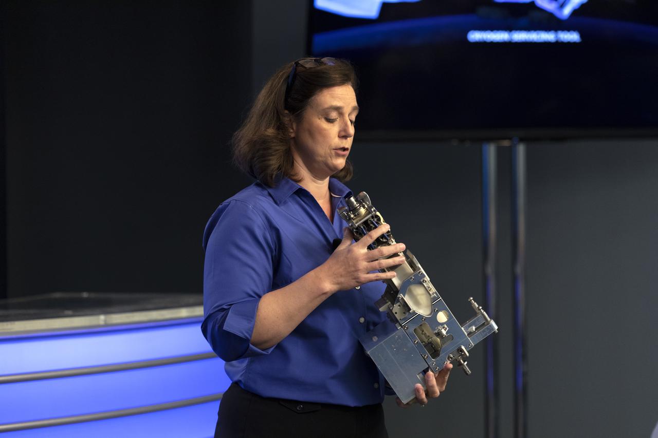 Jill McGuire, project manager for the Robotic Refueling Mission 3, or RRM3, experiment, describes RRM3 hardware for members of the media in the Kennedy Space Center’s Press Site auditorium. The briefing focused on research planned for launch to the International Space Station. The scientific materials and supplies will be aboard a Dragon spacecraft scheduled for liftoff from Cape Canaveral Air Force Station's Space Launch Complex 40. The SpaceX Falcon 9 rocket will launch the company's 16th Commercial Resupply Services mission to the space station.