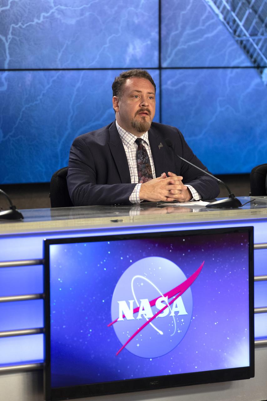 In the Kennedy Space Center’s Press Site auditorium, Kirt Costello, International Space Station program chief scientist at NASA's Johnson Space Center in Houston, speaks to members of the media during a prelaunch news conference for the SpaceX CRS-16 commercial resupply services mission to the International Space Station. A Dragon spacecraft is scheduled to be launched from Space Launch Complex 40 at Cape Canaveral Air Force Station. The SpaceX Falcon 9 rocket will lift off on the company's 16th Commercial Resupply Services mission to the space station.