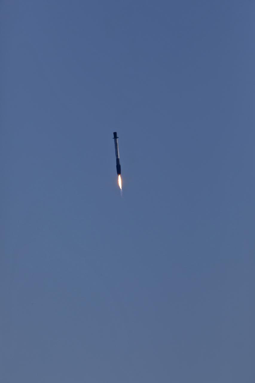 Following liftoff from Space Launch Complex 40 at Cape Canaveral Air Force Station, the first stage of a SpaceX Falcon 9 rocket returns to Landing Zone 1 at the Cape. At 1:16 p.m. EST, Dec. 5, 2018, a two-stage Falcon 9 launch vehicle began SpaceX's 16th Commercial Resupply Services mission carrying more than 5,600 pounds of research investigations and equipment, cargo and supplies that will support some of the hundreds of investigations aboard the International Space Station.