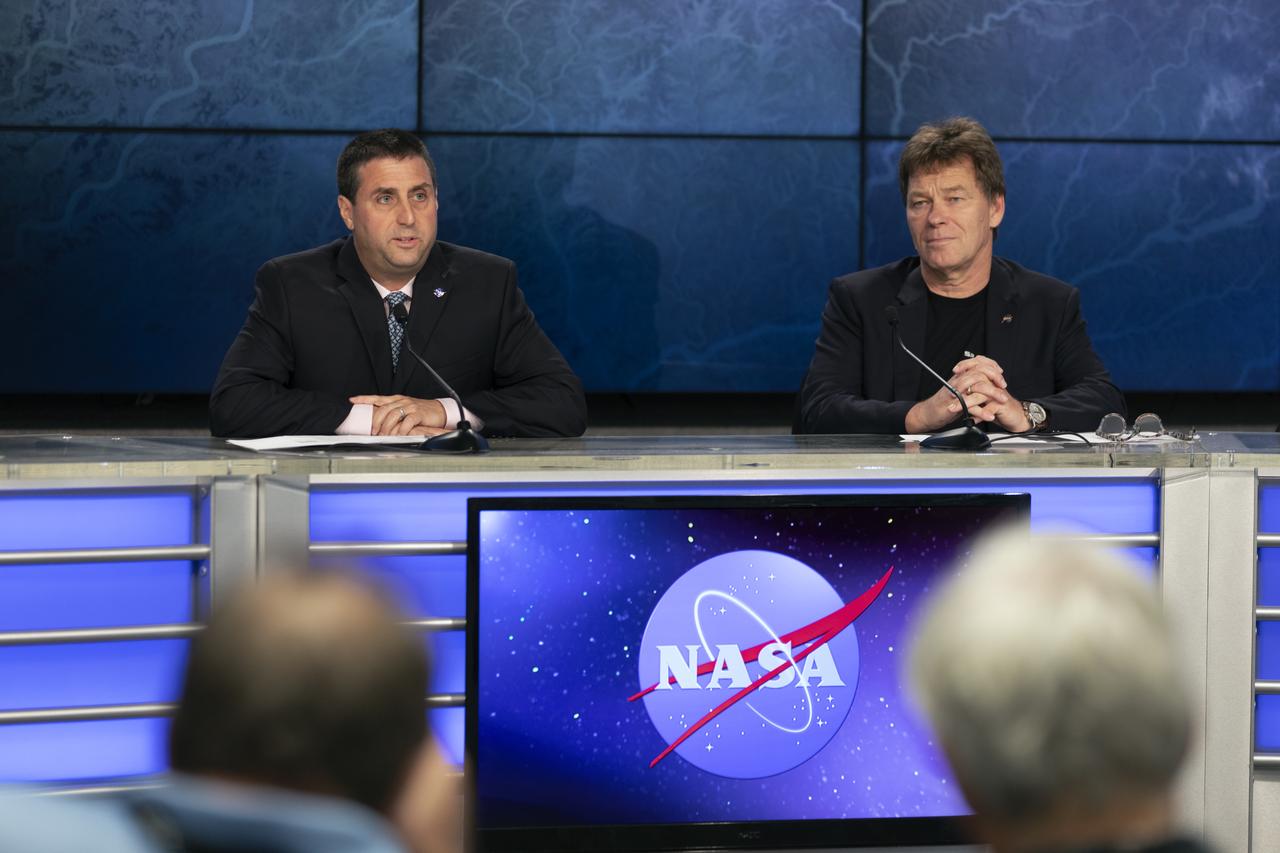 In the Press Site auditorium of NASA's Kennedy Space Center in Florida, Joel Montalbano, deputy International Space Station program manager at NASA's Johnson Space Center in Houston, left, and Hans Koenigsmann, vice president of Build and Flight Reliability for SpaceX, speak to media at a post-launch news conference following the liftoff of SpaceX CRS-16. The flight is a commercial resupply services mission to the International Space Station. SpaceX CRS-16 lifted off atop a Falcon 9 rocket from Space Launch Complex 40 at Cape Canaveral Air Force Station at 1:16 p.m. EST, Dec. 5, 2018, with supplies and equipment and new science experiments for technology research.