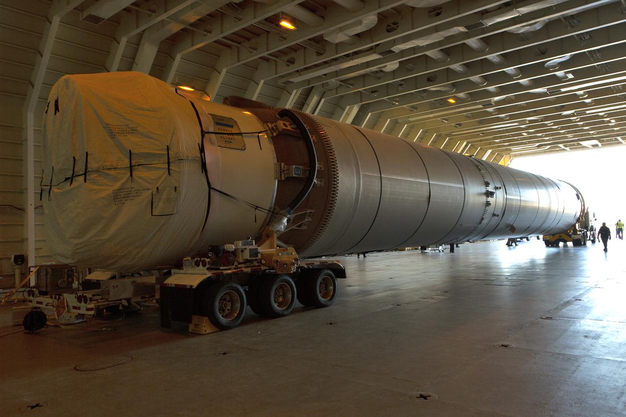 The first stage of the rocket that will launch Boeing's CST-100 Starliner spacecraft to the International Space Station on the company's uncrewed Orbital Flight Test arrives at Cape Canaveral Air Force Station in Florida on Dec. 7, 2018. The United Launch Alliance (ULA) Atlas V first stage booster was shipped aboard ULA's Mariner cargo vessel from the company's manufacturing plant in Decatur, Alabama. It is the final piece of hardware that ULA needs to launch the first Boeing Starliner. The booster will be transported to the Atlas Spaceflight Operations Center for receiving inspections and checkout.