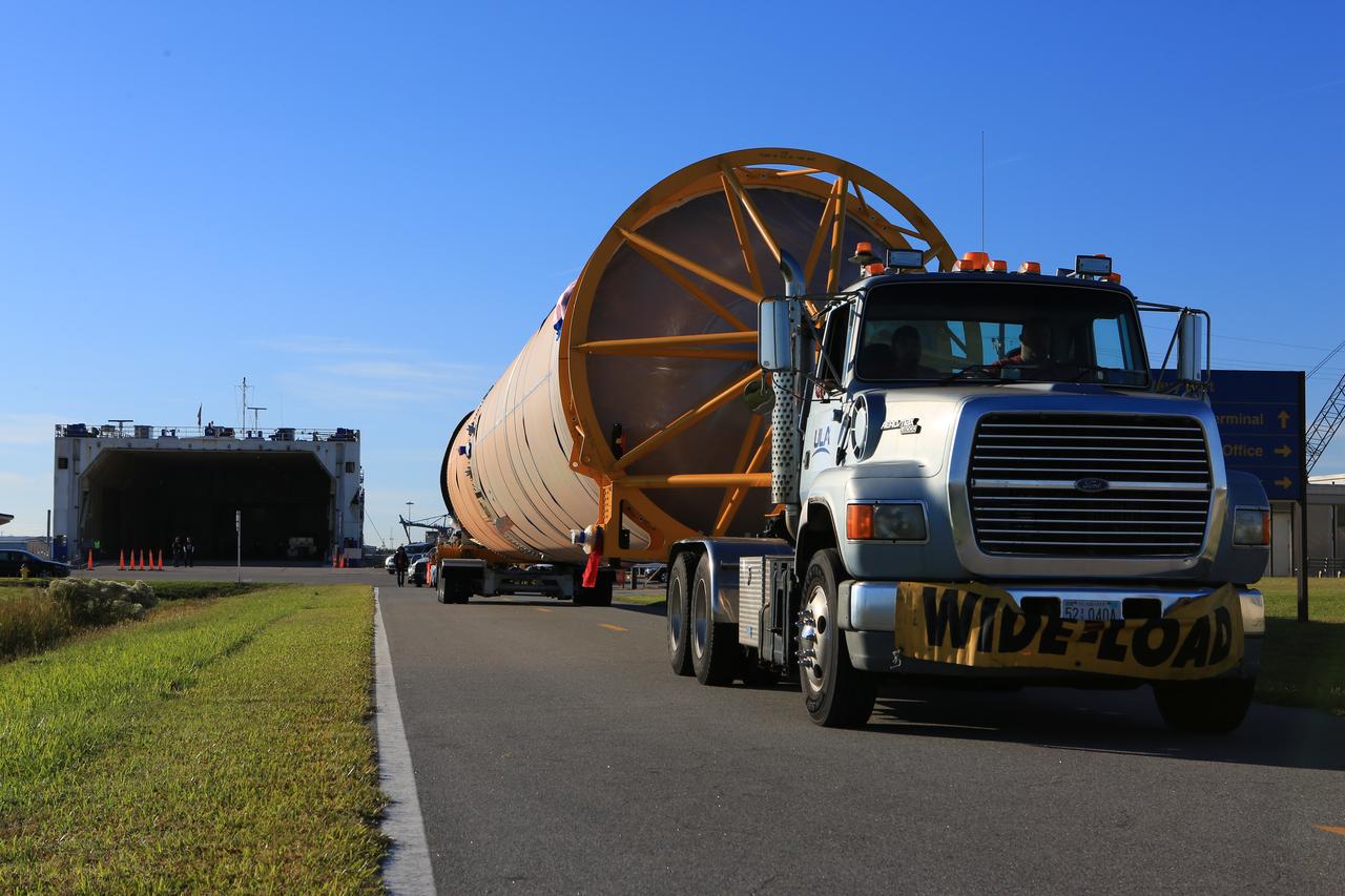 The first stage of the rocket that will launch Boeing's CST-100 Starliner spacecraft to the International Space Station on the company's uncrewed Orbital Flight Test arrives at Cape Canaveral Air Force Station in Florida on Dec. 7, 2018. The United Launch Alliance (ULA) Atlas V first stage booster was shipped aboard ULA's Mariner cargo vessel from the company's manufacturing plant in Decatur, Alabama. It is the final piece of hardware that ULA needs to launch the first Boeing Starliner. The booster will be transported to the Atlas Spaceflight Operations Center for receiving inspections and checkout.