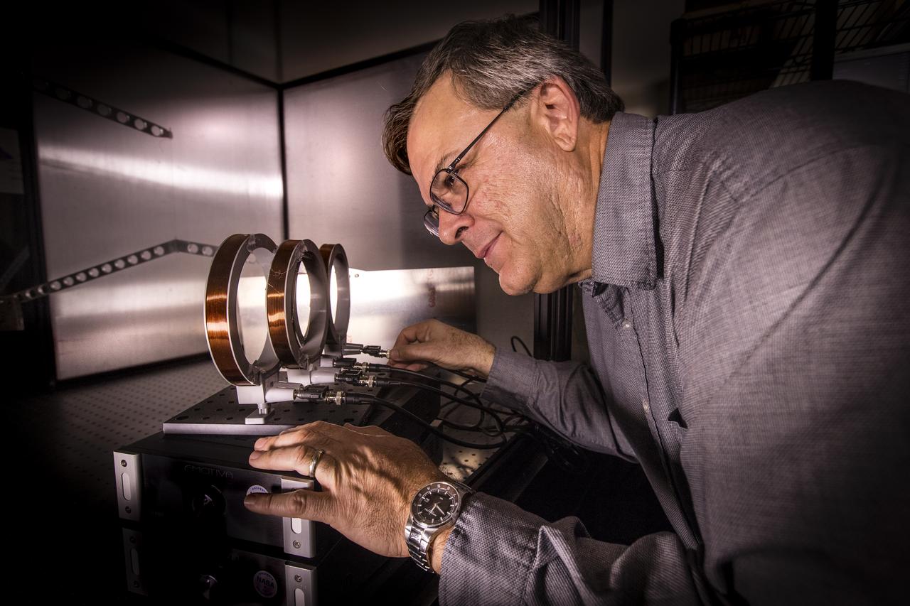 Dr. Mark Nurge, a physicist in the Applied Physics Laboratory at NASA’s Kennedy Space Center adjusted cables on an experiment setup on Dec. 12, 2018. The experiment seeks to find new methods of propulsion based on electromagnetism that could be used in robots to service the International Space Station.