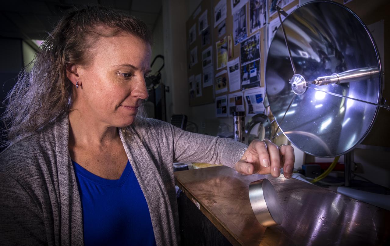 Principal investigator, Dr. Janine Captain, demonstrates the effects of moving a magnet against metal in the Applied Physics Laboratory at NASA’s Kennedy Space Center on Dec. 12, 2018. When dropped or tipped over on a plate of copper, the magnet decelerates and slowly touches down on the plate visually demonstrating the physics of the magnetic field.