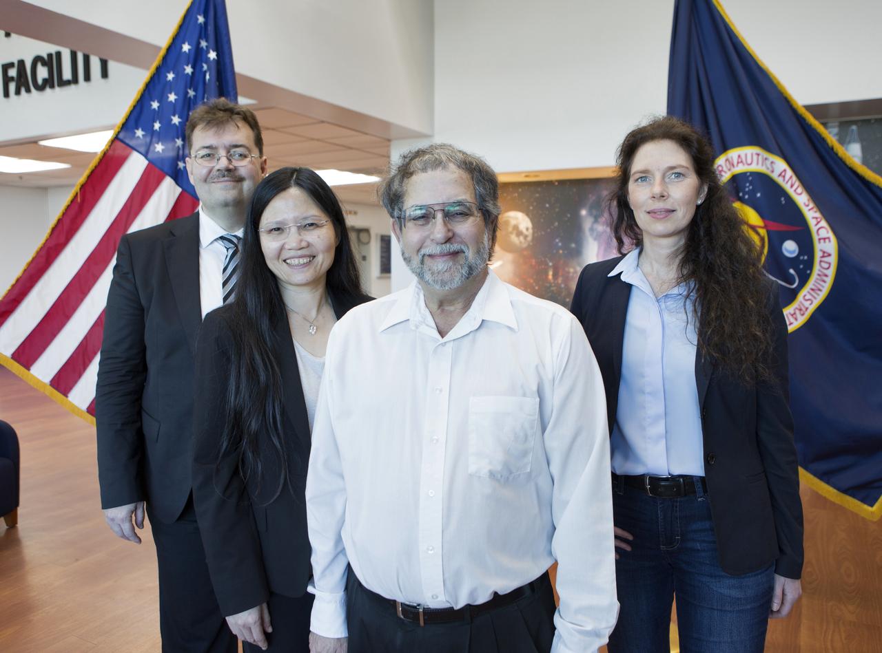 From left to right: Dr. Oliver Ullrich from the University of Zurich, Dr. Ye Zhang and Dr. Howard Levine of NASA's Kennedy Space Center, and Dr. Cora Thiel of the University of Zurich stood in the Space Station Processing Facility on Dec. 18, 2018. NASA recently signed a Space Act Agreement with the university, which is located in Switzerland, to collaborate on biological research. The team is studying gene expression in altered gravity.