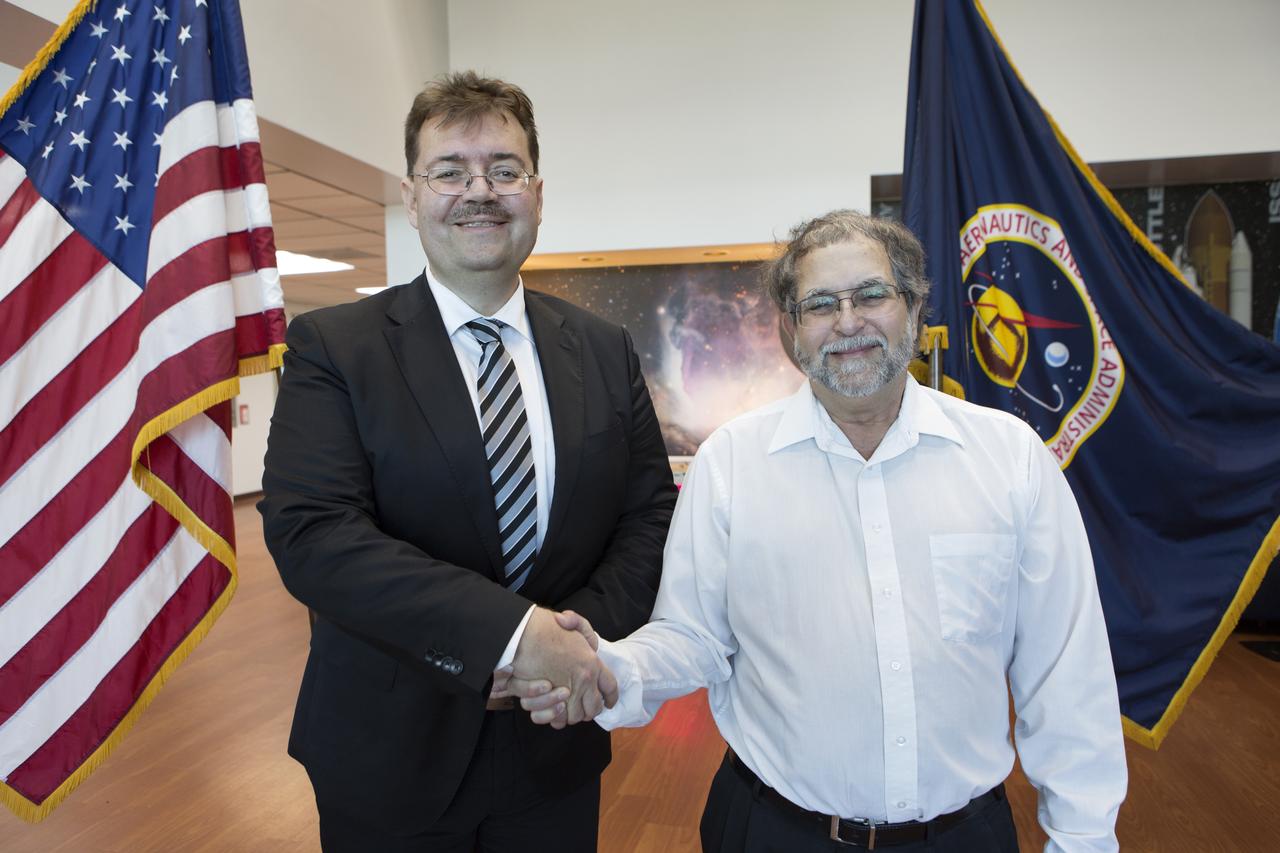 Dr. Oliver Ullrich (left) from the University of Zurich and Dr. Howard Levine of NASA's Kennedy Space Center stood in the Space Station Processing Facility on Dec. 18, 2018. NASA recently signed a Space Act Agreement with the university, which is located in Switzerland, to collaborate on biological research. The team is studying gene expression in altered gravity.
