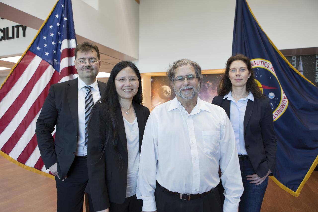 From left to right: Dr. Oliver Ullrich from the University of Zurich, Dr. Ye Zhang and Dr. Howard Levine of NASA's Kennedy Space Center, and Dr. Cora Thiel of the University of Zurich stood in the Space Station Processing Facility on Dec. 18, 2018. NASA recently signed a Space Act Agreement with the university, which is located in Switzerland, to collaborate on biological research. The team is studying gene expression in altered gravity.