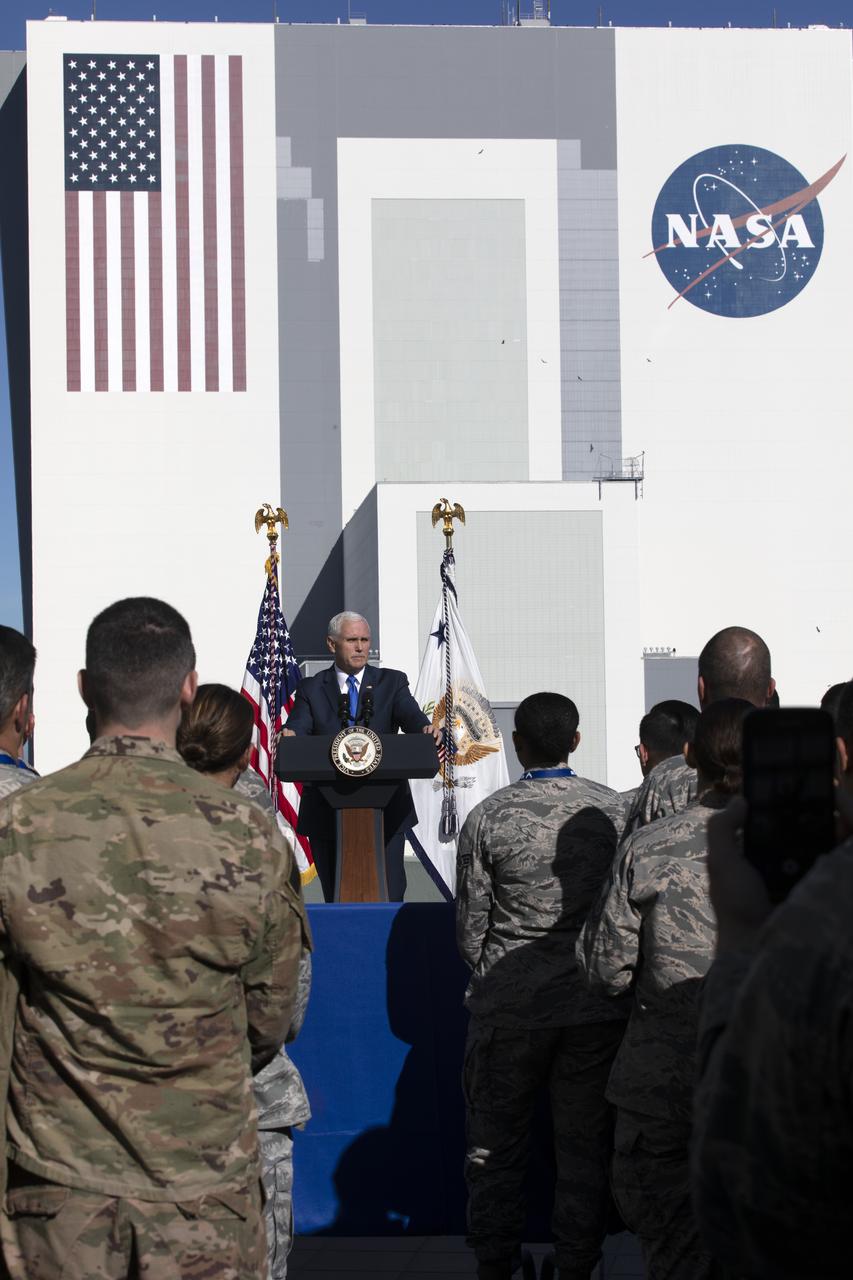 At the Operations and Support Building II at NASA's Kennedy Space Center in Florida, Vice President Mike Pence addresses members of the U.S. Air Force after the scrubbed launch attempt of SpaceX's Falcon 9 rocket carrying the Air Force's GPS III satellite from Space Launch Complex 40 on Cape Canaveral Air Force Station on Dec. 18, 2018.