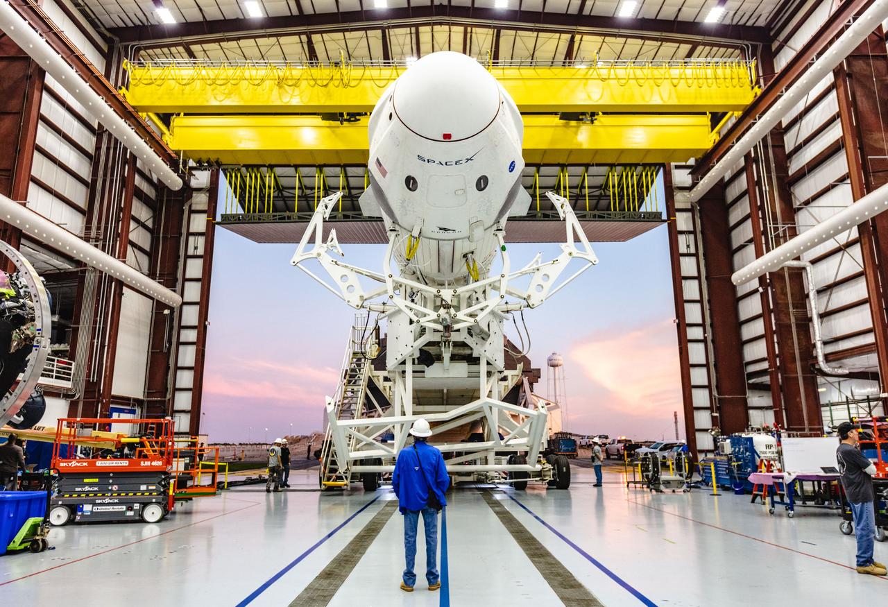 A SpaceX Falcon 9 rocket with the company’s Crew Dragon attached, rolls out of the company’s hangar at NASA Kennedy Space Center’s Launch Complex 39A on Jan. 3, 2019. The rocket will undergo checkouts prior to the liftoff of Demo-1, the inaugural flight of one of the spacecraft designed to take NASA astronauts to and from the International Space Station. NASA has worked with SpaceX and Boeing in developing Commercial Crew Program spacecraft to facilitate new human spaceflight systems launching from U.S. soil with the goal of safe, reliable and cost-effective access to low-Earth orbit destinations such as the space station.