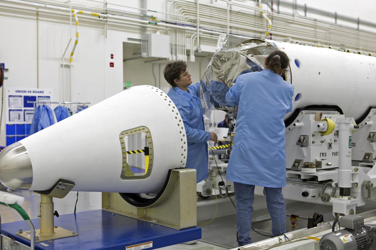 Inside the Launch Abort System Facility (LASF) at NASA’s Kennedy Space Center in Florida, workers assemble the Launch Abort System (LAS) on Feb. 5, 2019, that will be used for the Orion Ascent Abort-2 (AA-2) Flight Test. AA-2 is a full-stress test of the LAS, scheduled for Spring 2019. AA-2 will launch from Space Launch Complex 46, carrying a fully functional LAS and a 22,000-pound Orion test vehicle to an altitude of 31,000 feet and traveling at more than 1,000 miles an hour. The test will verify the LAS can steer the crew module and astronauts aboard to safety in the event of an issue with the Space Launch System (SLS) rocket when the spacecraft is under the highest aerodynamic loads it will experience during a rapid climb into space. NASA's Orion and Exploration Ground Systems programs and contractors from Jacob's and Northrop Grumman in conjunction with the Air Force Space and Missile Center's Launch Operations branch are performing flight operations for AA-2.