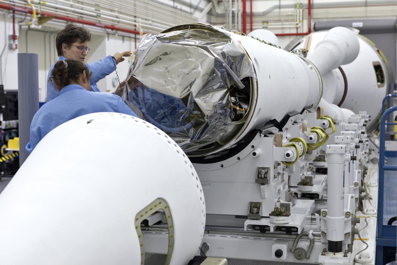 Inside the Launch Abort System Facility (LASF) at NASA’s Kennedy Space Center in Florida, workers assemble the Launch Abort System (LAS) on Feb. 5, 2019, that will be used for the Orion Ascent Abort-2 (AA-2) Flight Test. AA-2 is a full-stress test of the LAS, scheduled for Spring 2019. AA-2 will launch from Space Launch Complex 46, carrying a fully functional LAS and a 22,000-pound Orion test vehicle to an altitude of 31,000 feet and traveling at more than 1,000 miles an hour. The test will verify the LAS can steer the crew module and astronauts aboard to safety in the event of an issue with the Space Launch System (SLS) rocket when the spacecraft is under the highest aerodynamic loads it will experience during a rapid climb into space. NASA's Orion and Exploration Ground Systems programs and contractors from Jacob's and Northrop Grumman in conjunction with the Air Force Space and Missile Center's Launch Operations branch are performing flight operations for AA-2.