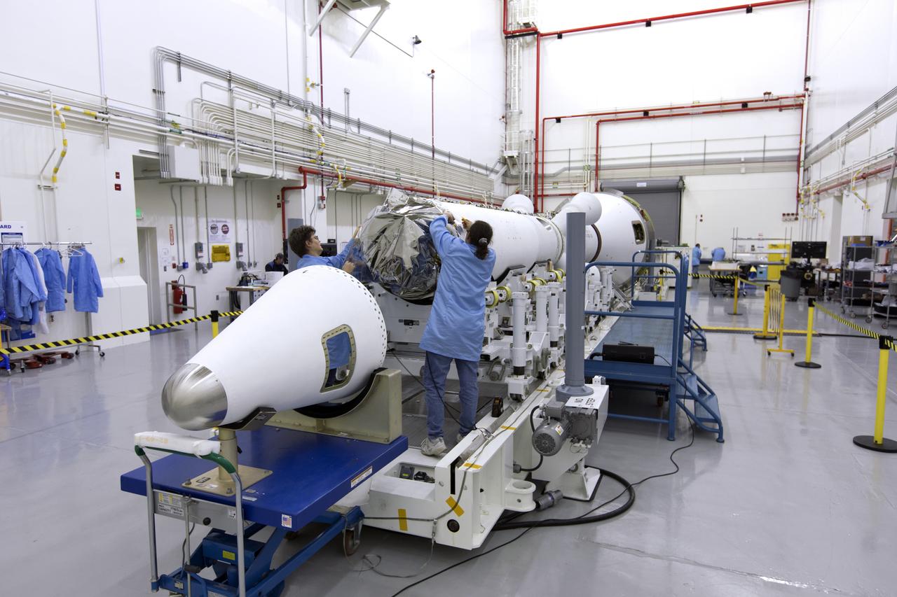 Inside the Launch Abort System Facility (LASF) at NASA’s Kennedy Space Center in Florida, workers assemble the Launch Abort System (LAS) on Feb. 5, 2019, that will be used for the Orion Ascent Abort-2 (AA-2) Flight Test. AA-2 is a full-stress test of the LAS, scheduled for Spring 2019. AA-2 will launch from Space Launch Complex 46, carrying a fully functional LAS and a 22,000-pound Orion test vehicle to an altitude of 31,000 feet and traveling at more than 1,000 miles an hour. The test will verify the LAS can steer the crew module and astronauts aboard to safety in the event of an issue with the Space Launch System (SLS) rocket when the spacecraft is under the highest aerodynamic loads it will experience during a rapid climb into space. NASA's Orion and Exploration Ground Systems programs and contractors from Jacob's and Northrop Grumman in conjunction with the Air Force Space and Missile Center's Launch Operations branch are performing flight operations for AA-2.