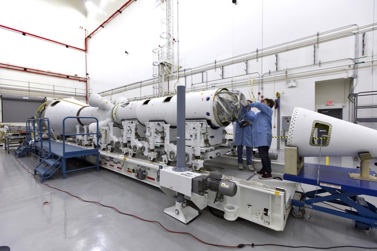 Inside the Launch Abort System Facility (LASF) at NASA’s Kennedy Space Center in Florida, workers assemble the Launch Abort System (LAS) on Feb. 5, 2019, that will be used for the Orion Ascent Abort-2 (AA-2) Flight Test. AA-2 is a full-stress test of the LAS, scheduled for Spring 2019. AA-2 will launch from Space Launch Complex 46, carrying a fully functional LAS and a 22,000-pound Orion test vehicle to an altitude of 31,000 feet and traveling at more than 1,000 miles an hour. The test will verify the LAS can steer the crew module and astronauts aboard to safety in the event of an issue with the Space Launch System (SLS) rocket when the spacecraft is under the highest aerodynamic loads it will experience during a rapid climb into space. NASA's Orion and Exploration Ground Systems programs and contractors from Jacob's and Northrop Grumman in conjunction with the Air Force Space and Missile Center's Launch Operations branch are performing flight operations for AA-2.