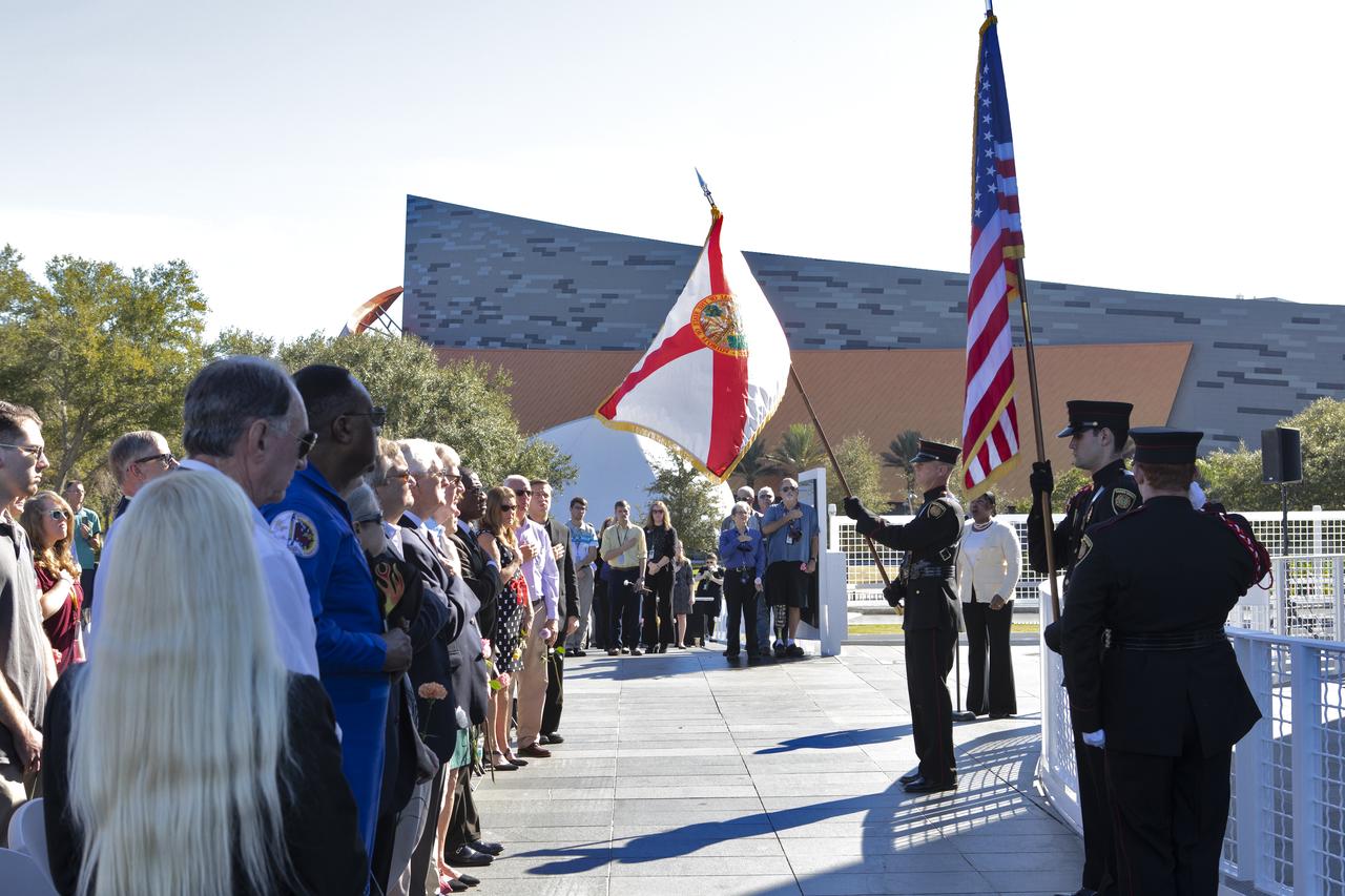 The Brevard County Fire Rescue Honor Guard presents the colors during the singing of the national anthem by retired Army Lt. Col. Cynthia Watkins during this year’s Day of Remembrance ceremony at the Kennedy Space Center Visitor Complex. Each year, Kennedy employees and guests gather with others throughout NASA to honor those astronauts who have fallen in the pursuit of space exploration.