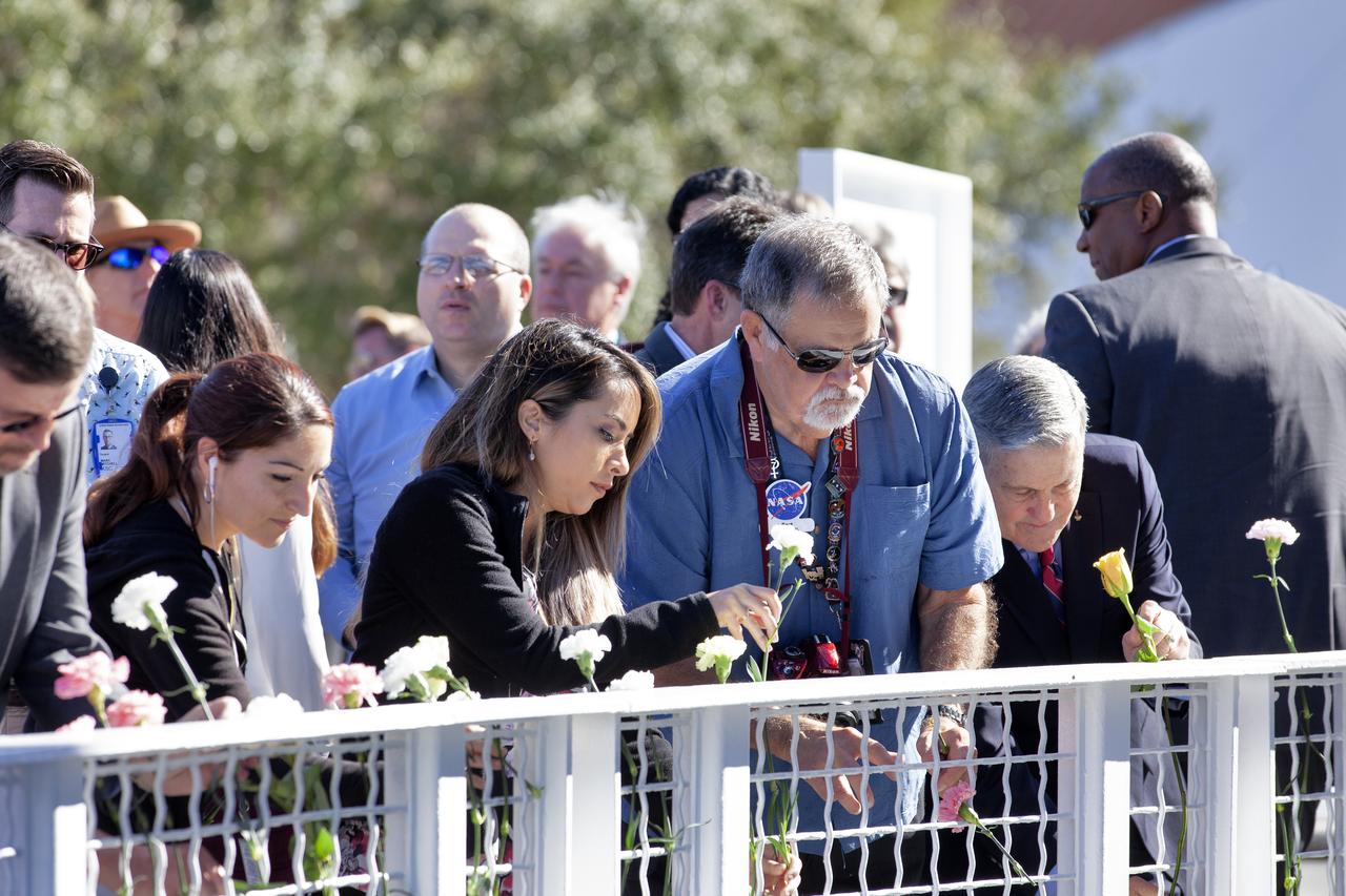 Kennedy Space Center Director Bob Cabana and guests place flowers in front of the Space Mirror Memorial at the Kennedy Space Center Visitor Complex during this year’s Day of Remembrance ceremony. The memorial, a 42-foot-high by 50-foot-wide granite monument, displays the names of the fallen astronauts from Apollo 1, space shuttles Challenger and Columbia, as well as others who have lost their lives while on NASA missions or in training. Each year, Kennedy employees and guests gather with others throughout NASA to honor those astronauts who have fallen in the pursuit of space exploration.