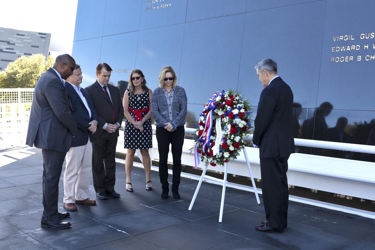 During this year’s Day of Remembrance ceremony at the Kennedy Space Center Visitor Complex, from left, Kennedy Associate Director Kelvin Manning, former Shuttle Launch Director Michael Leinbach, President and Chief Executive Officer of the Astronauts Memorial Foundation (AMF) Thad Altman, AMF Vice Chair Sheryl Chaffee, Kennedy Deputy Director Janet Petro, and Kennedy Center Director Bob Cabana stand in a moment of silence after placing a memorial wreath in front of the Space Mirror Memorial. Each year, Kennedy employees and guests gather with others throughout NASA to honor those astronauts who have fallen in the pursuit of space exploration.