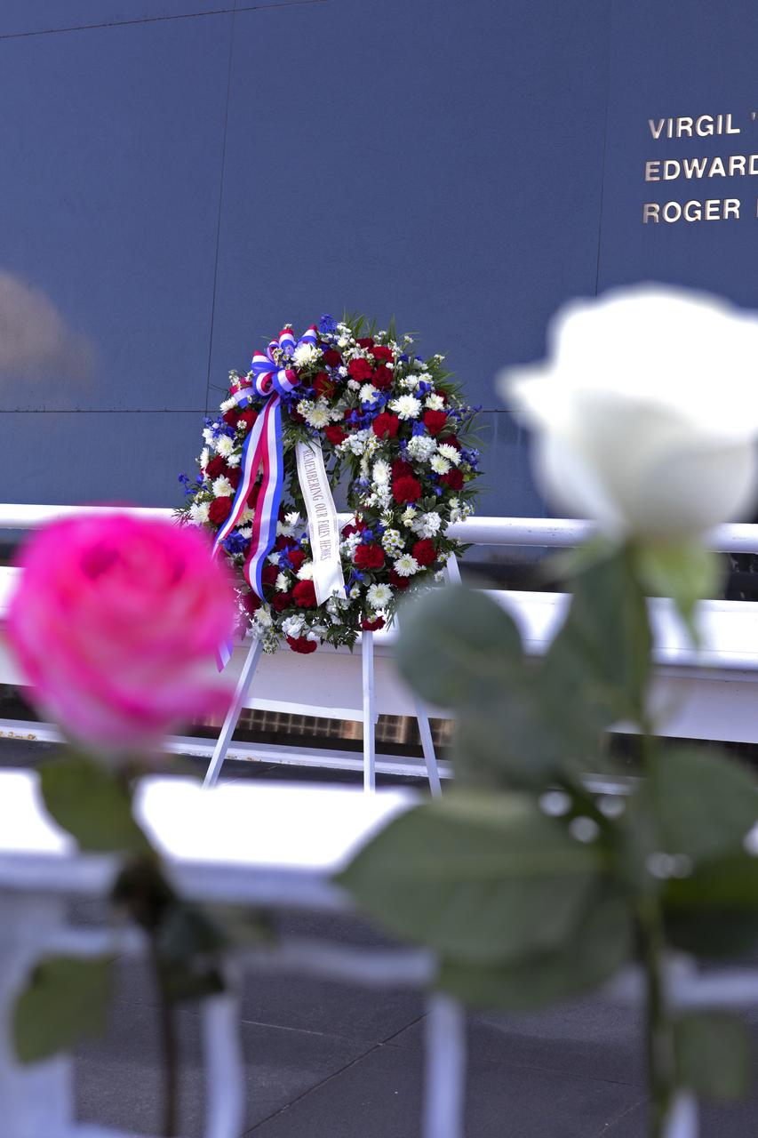 Flowers are placed in front of the Space Mirror Memorial at the Kennedy Space Center Visitor Complex after this year’s Day of Remembrance ceremony. The memorial, a 42-foot-high by 50-foot-wide granite monument, displays the names of the fallen astronauts from Apollo 1, space shuttles Challenger and Columbia, as well as others who have lost their lives while on NASA missions or in training. Each year, Kennedy employees and guests gather with others throughout NASA to honor those astronauts who have fallen in the pursuit of space exploration.