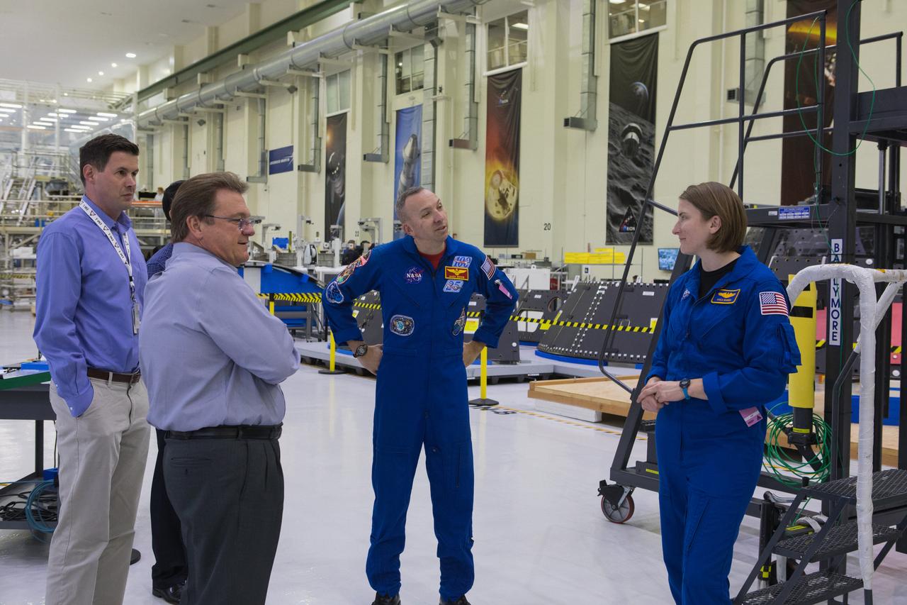 NASA astronaut Randy Bresnik, center, and astronaut candidate Kayla Barron, far right, tour the Operations and Checkout Building high bay at the agency’s Kennedy Space Center in Florida on Feb. 12, 2019. They viewed all of the hardware in the high bay that is being processed for Exploration Mission-1 and Exploration Mission-2. Accompanying them are Jules Schneider, director, Assembly, Test and Launch Operations (ATLO) with Lockheed Martin; Nathan Varn, senior manager, ATLO with Lockheed Martin; and Glenn Chin, deputy manager, NASA Orion Production Operations.