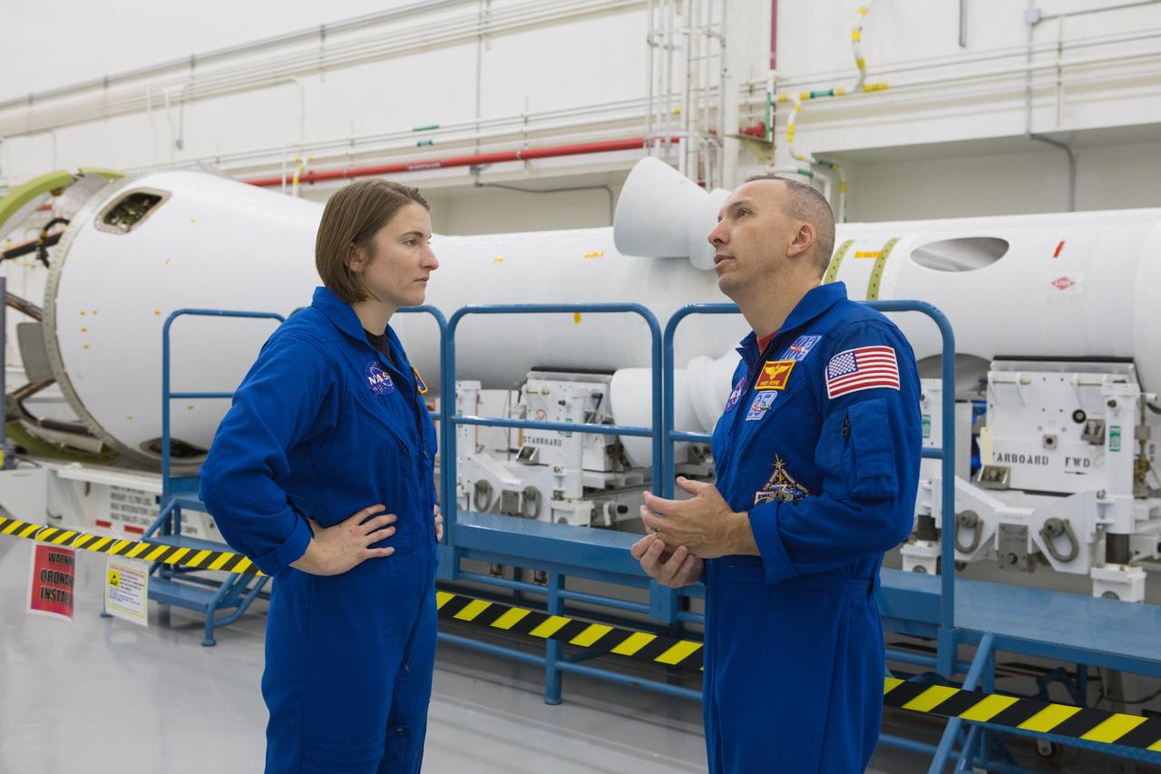 Astronaut candidate Kayla Barron, at left, and NASA astronaut Randy Bresnik tour the Launch Abort System Facility (LASF) at NASA’s Kennedy Space Center in Florida on Feb. 12, 2019. They viewed the Launch Abort System (LAS) that will be used for the Orion Ascent Abort-2 (AA-2) Flight Test. AA-2 is a full-stress test of the LAS, scheduled for Spring 2019. AA-2 will launch from Space Launch Complex 46, carrying a fully functional LAS and a 22,000-pound Orion test vehicle to an altitude of 31,000 feet and traveling at more than 1,000 miles an hour. The test will verify the LAS can steer the crew module and astronauts aboard to safety in the event of an issue with the Space Launch System (SLS) rocket when the spacecraft is under the highest aerodynamic loads it will experience during a rapid climb into space. NASA's Orion and Exploration Ground Systems programs and contractors from Jacob's and Northrop Grumman in conjunction with the Air Force Space and Missile Center's Launch Operations branch are performing flight operations for AA-2.