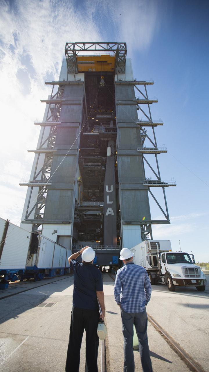 A crane is used to hoist a test version of the Multi-Mission Radioisotope Thermoelectric Generator (MMRTG) for NASA’s Mars 2020 mission up and into the United Launch Alliance Vertical Integration Facility (VIF) at Space Launch Complex 41 at Cape Canaveral Air Force Station in Florida on Feb. 15, 2019. The MMRTG simulator is being used to practice operations and procedures for carefully lifting it up and into the VIF. The Mars 2020 rover mission is targeted to launch in July 2020 on a ULA Atlas V rocket from Pad 41. Mars 2020 is part of NASA’s Mars Exploration Program, a long-term effort of robotic exploration of the Red Planet. The rover will search for habitable conditions in the ancient past and signs of past microbial life on Mars. 