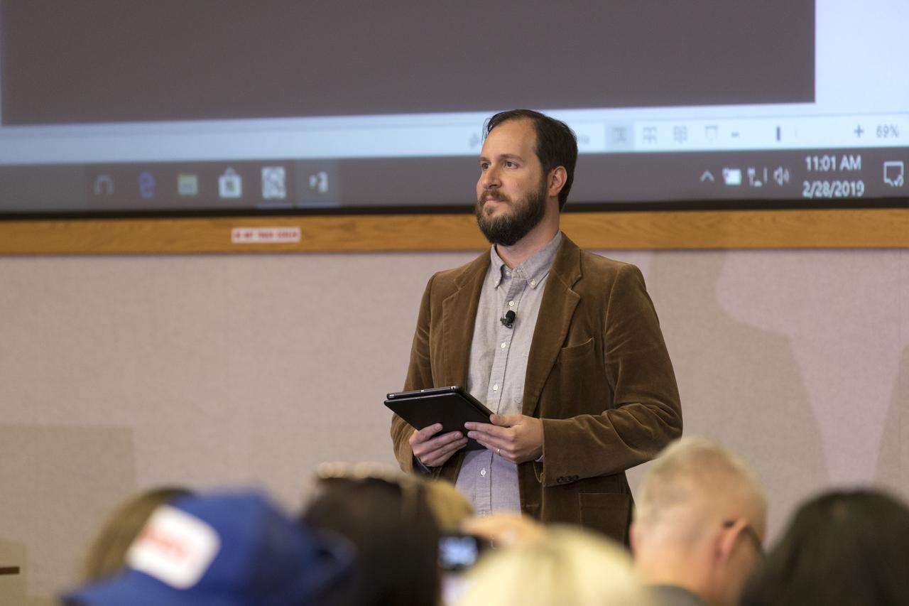 Moderator McManus Woodend, NASA Communications, speaks to members of the media Thursday, Feb. 28, in the Kennedy Space Center’s Mission Briefing Room of the Neil Armstrong Operations and Checkout Building. The briefing focused on launch of the SpaceX Demo-1 Commercial Crew Program mission to the International Space Station. The inaugural flight of the Crew Dragon, known as Demo-1, will be uncrewed, lifting off atop a SpaceX Falcon 9 rocket from Launch Complex 39A at Kennedy Saturday, March 2, at 2:49 a.m. EST. The mission is designed to validate end-to-end systems and capabilities, leading to certification to fly crew. NASA has worked with SpaceX and Boeing in developing the CCP spacecraft to facilitate new human spaceflight systems launching from U.S. soil with the goal of safe, reliable and cost-effective access to low-Earth orbit destinations such as the space station.