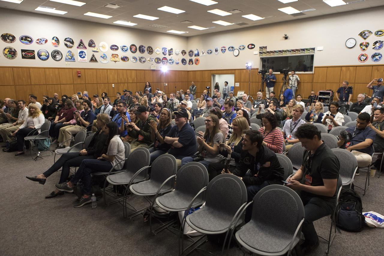 Members of the media, along with NASA and SpaceX officials, gather in the Kennedy Space Center’s Mission Briefing Room of the Neil Armstrong Operations and Checkout Building on Thursday, Feb. 28. The briefing focused on launch of the SpaceX Demo-1 Commercial Crew Program mission to the International Space Station. The inaugural flight of the Crew Dragon, known as Demo-1, will be uncrewed, lifting off atop a SpaceX Falcon 9 rocket from Launch Complex 39A at Kennedy Saturday, March 2, at 2:49 a.m. EST. The mission is designed to validate end-to-end systems and capabilities, leading to certification to fly crew. NASA has worked with SpaceX and Boeing in developing the CCP spacecraft to facilitate new human spaceflight systems launching from U.S. soil with the goal of safe, reliable and cost-effective access to low-Earth orbit destinations such as the space station.